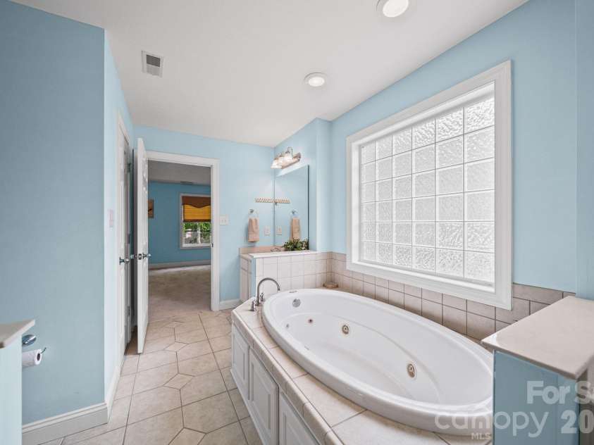 1042 Marguerite Drive, Lowell, NC 28098.  MLS# CAR4397338, YatesRealty ID 34172. Primary bath