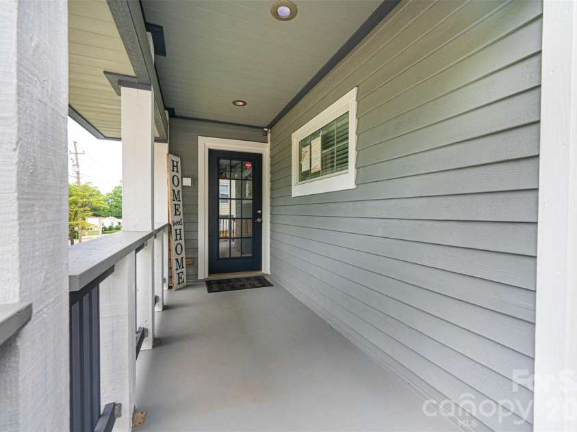 233 Eastside Drive, Statesville, NC 28625.  MLS# CAR4397585, YatesRealty ID 34174. Front porch