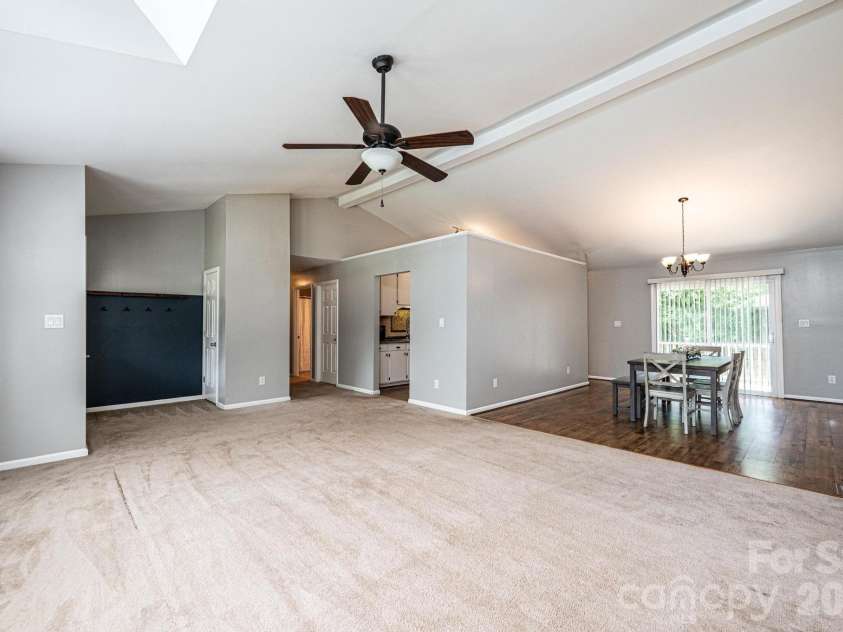 4158 Arrowhead Drive, Hickory, NC 28601.  MLS# CAR4394380, YatesRealty ID 34176. Living room into dining area