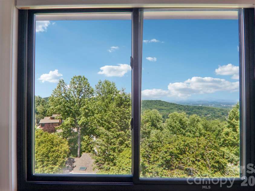 138 Woodbridge Drive, Hendersonville, NC 28739.  MLS# CAR4391133, YatesRealty ID 34178. Long Range Mts Views from almost every room