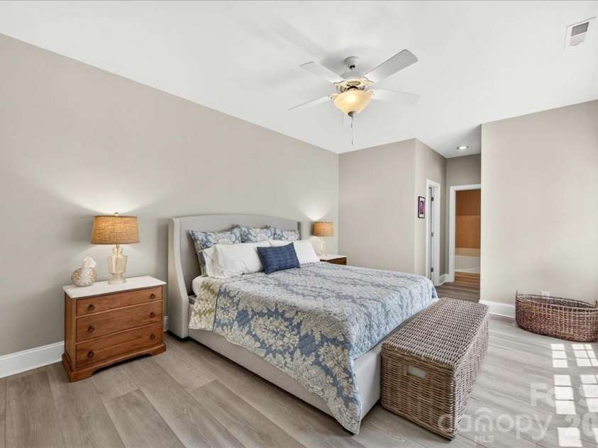 242 Faulkner Way, Davidson, NC 28036.  MLS# CAR4395516, YatesRealty ID 34179. Spacious Primary Bedroom on the main level