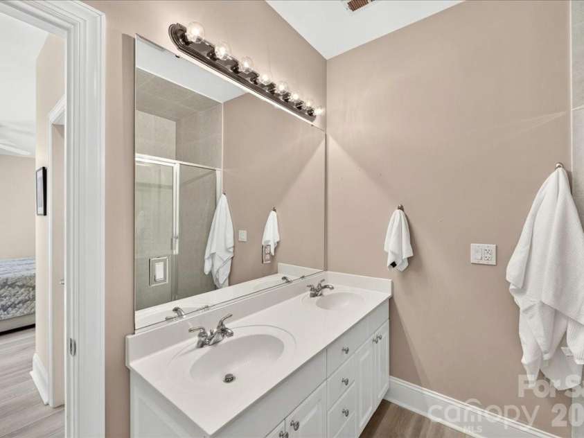 242 Faulkner Way, Davidson, NC 28036.  MLS# CAR4395516, YatesRealty ID 34179. Two sinks in the en-suite Primary Bathroom