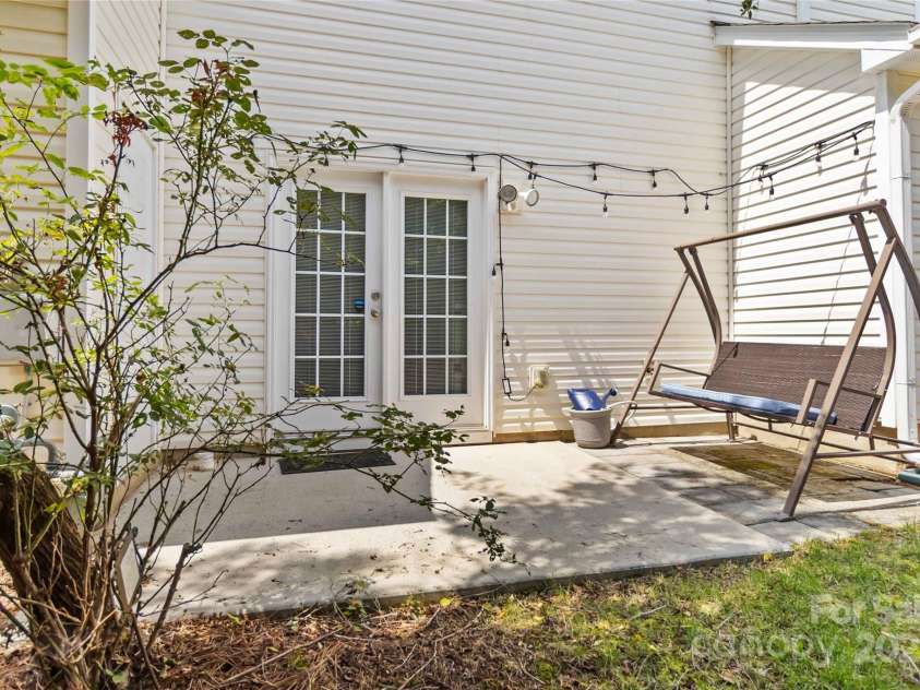 8437 Big Creek Court, Matthews, NC 28105.  MLS# CAR4287368, YatesRealty ID 34185. Great private patio that connects to the Primary bedroom on the main floor