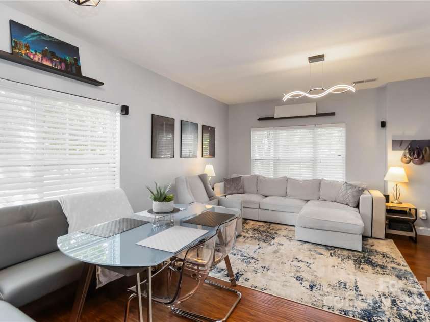 8437 Big Creek Court, Matthews, NC 28105.  MLS# CAR4287368, YatesRealty ID 34185. Lots of natural light coming into this end unit townhome!