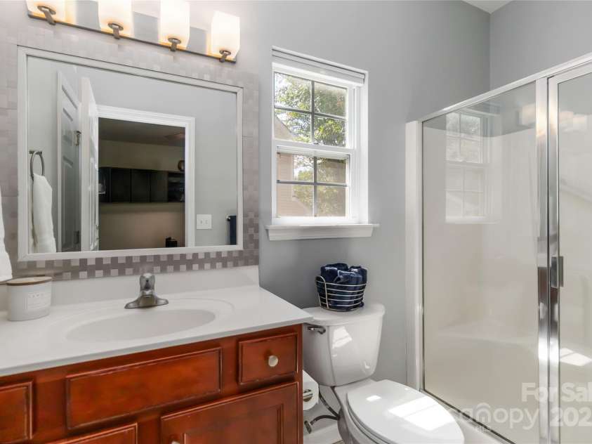 8437 Big Creek Court, Matthews, NC 28105.  MLS# CAR4287368, YatesRealty ID 34185. Primary bath on main with walk-in shower!
