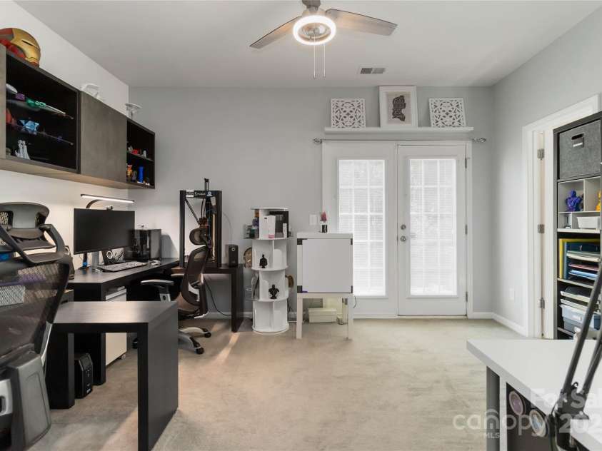 8437 Big Creek Court, Matthews, NC 28105.  MLS# CAR4287368, YatesRealty ID 34185. Primary bedroom on main floor, currently being used an a dual office.