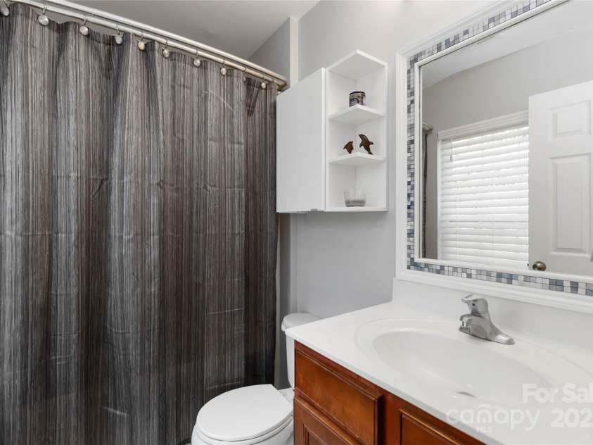 8437 Big Creek Court, Matthews, NC 28105.  MLS# CAR4287368, YatesRealty ID 34185. Primary bedroom upstairs bath ensuite with window!