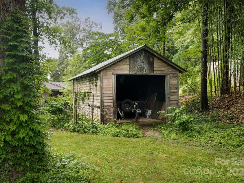 56 Lockley Avenue, Asheville, NC 28804.  MLS# CAR4294386, YatesRealty ID 34186. Garage at the back of property