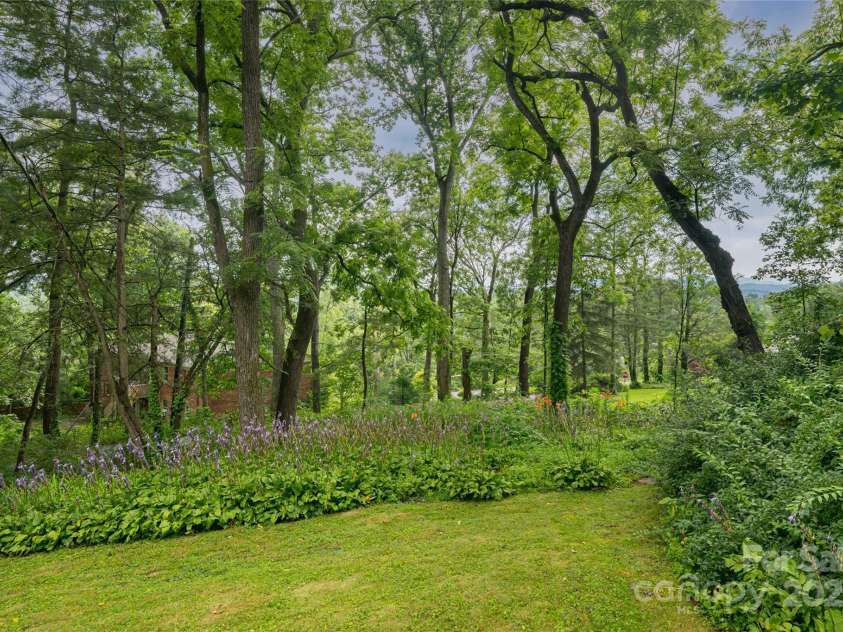 56 Lockley Avenue, Asheville, NC 28804.  MLS# CAR4294386, YatesRealty ID 34186. Home has a large yard
