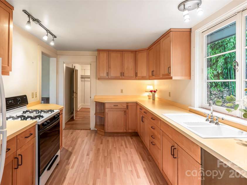 56 Lockley Avenue, Asheville, NC 28804.  MLS# CAR4294386, YatesRealty ID 34186. Kitchen with large windows over the sink