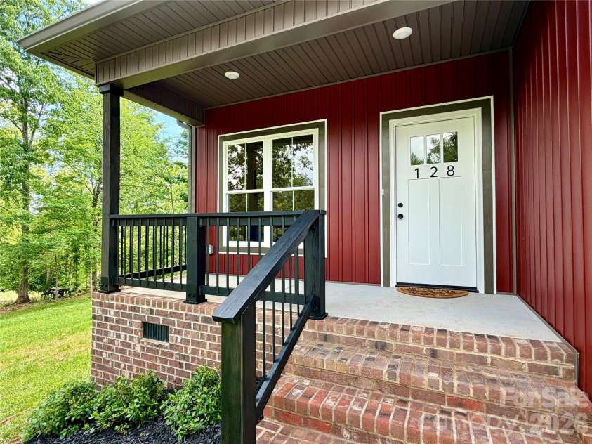 128 Arrowood Lane, Harmony, NC 28634.  MLS# CAR4385564, YatesRealty ID 34193. Front porch