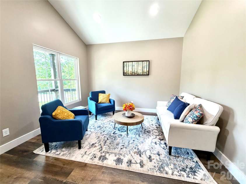 128 Arrowood Lane, Harmony, NC 28634.  MLS# CAR4385564, YatesRealty ID 34193. Living room