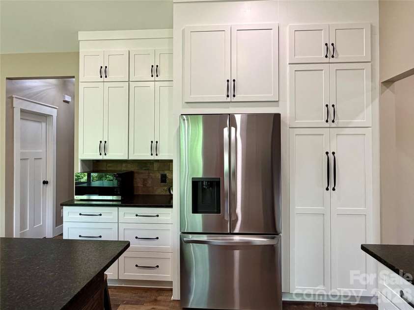 128 Arrowood Lane, Harmony, NC 28634.  MLS# CAR4385564, YatesRealty ID 34193. Pantry and coffee bar area