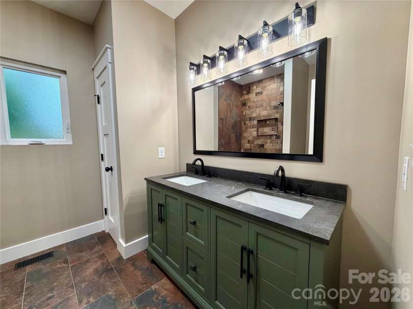 128 Arrowood Lane, Harmony, NC 28634.  MLS# CAR4385564, YatesRealty ID 34193. Primary bath
