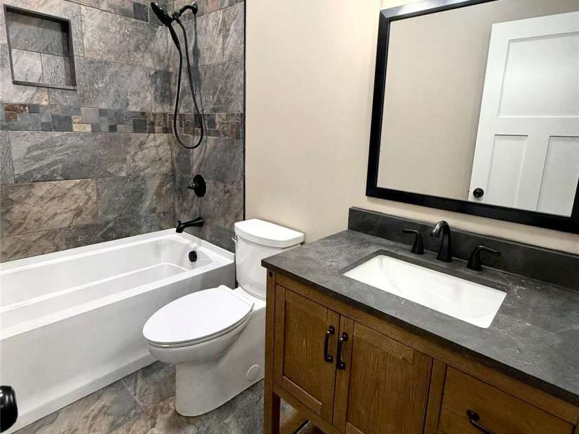 128 Arrowood Lane, Harmony, NC 28634.  MLS# CAR4385564, YatesRealty ID 34193. Secondary bathroom