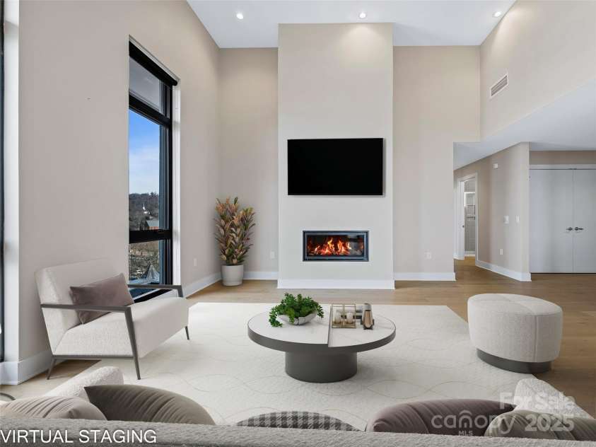 145 Biltmore Avenue, Asheville, NC 28801.  MLS# CAR4331069, YatesRealty ID 342. Spacious Living Room with gas fireplace