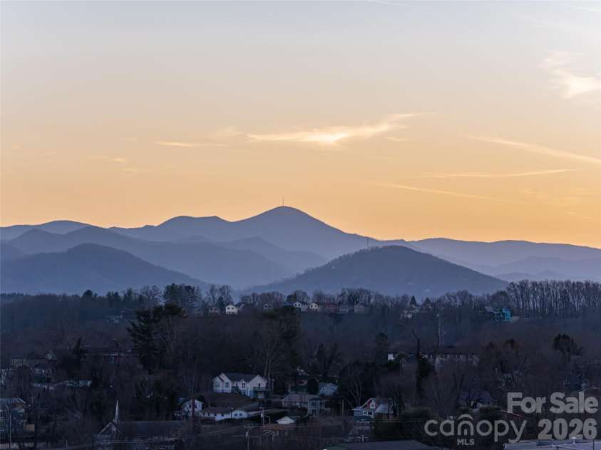 145 Biltmore Avenue, Asheville, NC 28801.  MLS# CAR4372434, YatesRealty ID 342. Layered unobstructed  mountain views at sunset