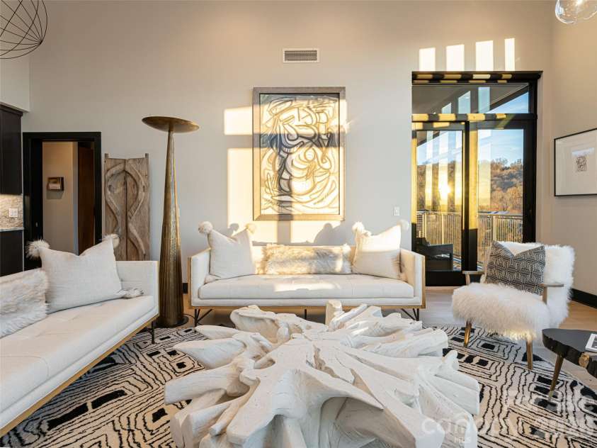 145 Biltmore Avenue, Asheville, NC 28801.  MLS# CAR4372434, YatesRealty ID 342. Local artwork as well as artwork purchased internationally grace the walls adding to the sophisticated feel of this condo.