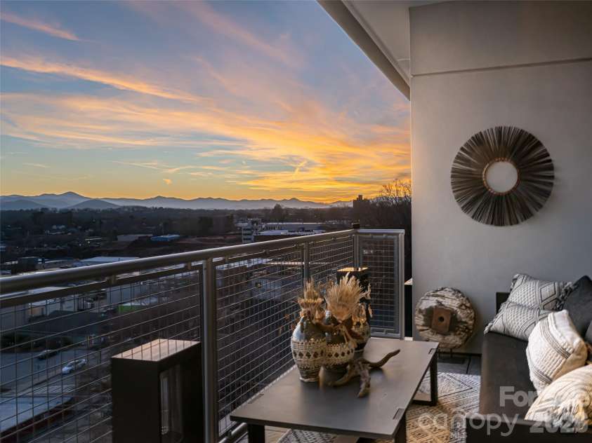 145 Biltmore Avenue, Asheville, NC 28801.  MLS# CAR4372434, YatesRealty ID 342. One  of two large balconies, beautifully furnished, await you and your guests