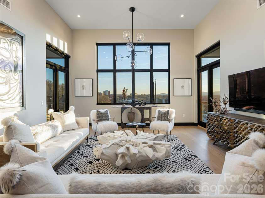145 Biltmore Avenue, Asheville, NC 28801.  MLS# CAR4372434, YatesRealty ID 342. Top floor ( 7th) Penthouse at 145 Biltmore Avenue in South Slope, Asheville.  Professionally designed and furnished by a local interior decorator,  All furnishing included in price.  Large panoramic window offers wide, s
