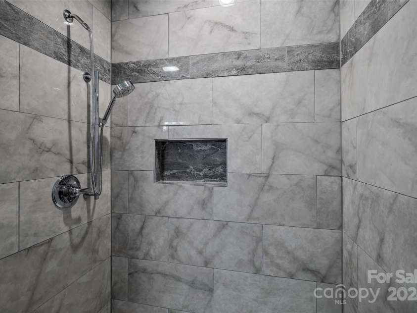 13 Roberts Street, Weaverville, NC 28787.  MLS# CAR4202654, YatesRealty ID 3420. Custom Tiled Shower in Basement