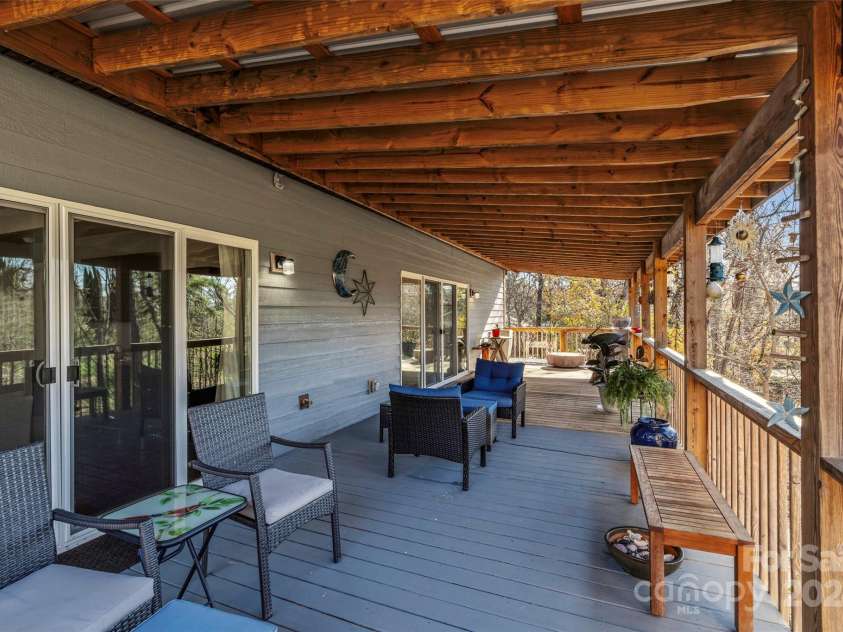 13 Roberts Street, Weaverville, NC 28787.  MLS# CAR4202654, YatesRealty ID 3420. Main Level Deck Access from the Primary Suite