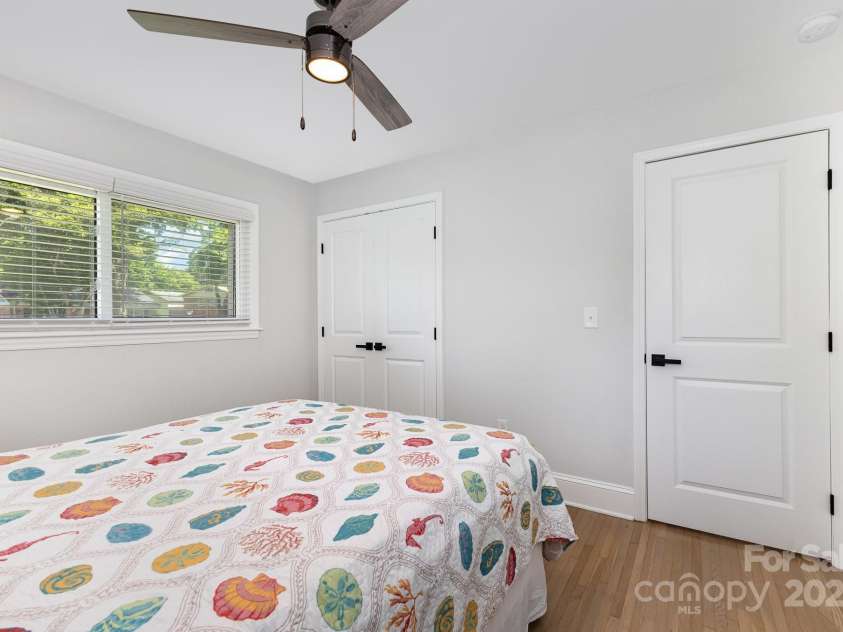 3615 Kempton Place, Charlotte, NC 28208.  MLS# CAR4262942, YatesRealty ID 34200. Second bedroom with ceiling fan and storage.