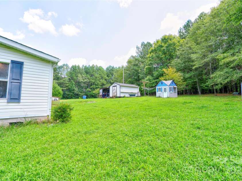 2338 Whelchel Road, Mooresboro, NC 28114.  MLS# CAR4219380, YatesRealty ID 34202. Back Yard