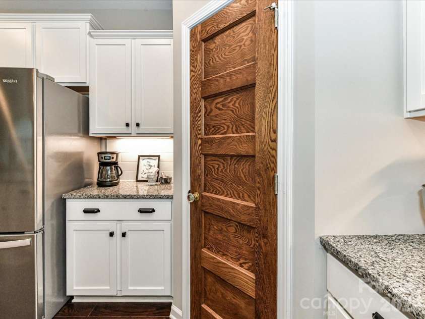 1733 Tranquility Boulevard, Lancaster, SC 29720.  MLS# CAR4393535, YatesRealty ID 34204. Antique Wood Door on Pantry
