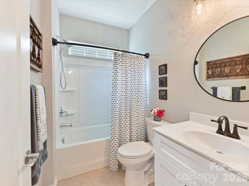 1733 Tranquility Boulevard, Lancaster, SC 29720.  MLS# CAR4393535, YatesRealty ID 34204. Guest Bath with Tiled Flooring and Gentleman Height Cabinet