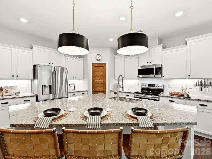 1733 Tranquility Boulevard, Lancaster, SC 29720.  MLS# CAR4393535, YatesRealty ID 34204. Welcome to this Gorgeous Kitchen! Updated Pendant Lighting over Island, Granite Counters, and Recessed Lighting