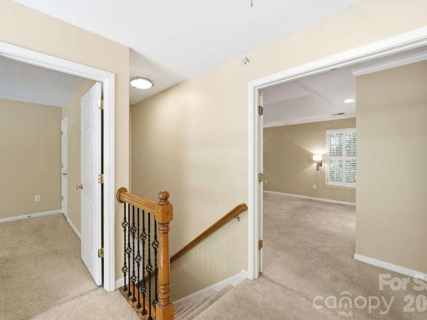 7711 Abbotsinch Court, Charlotte, NC 28269.  MLS# CAR4397485, YatesRealty ID 34205. Double doors open into primary suit.