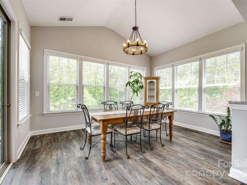 288 Ridge Reserve Drive, Lake Wylie, SC 29710.  MLS# CAR4249323, YatesRealty ID 34210. Surrounded by windows, this charming breakfast nook offers tree-lined views and natural light—a serene setting for everyday meals or special occasions.