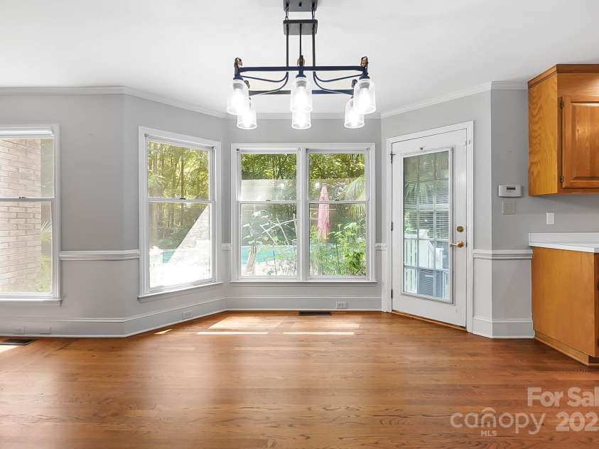 9921 Hanging Moss Trail, Mint Hill, NC 28227.  MLS# CAR4293455, YatesRealty ID 34217. Breakfast nook with bay window overlooking the pool and backyard.