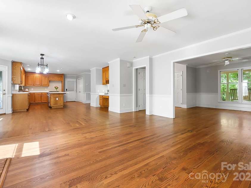 9921 Hanging Moss Trail, Mint Hill, NC 28227.  MLS# CAR4293455, YatesRealty ID 34217. Family room looking into the kitchen and the living room/flex room