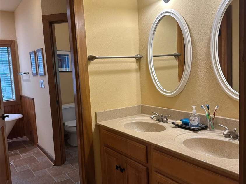 222 Creekside Way, Burnsville, NC 28714.  MLS# CAR4393294, YatesRealty ID 3423. Primary Bath double sinks