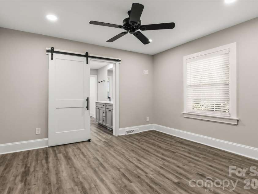 201 Elm Street, Wingate, NC 28174.  MLS# CAR4398796, YatesRealty ID 34232. Primary Bedroom