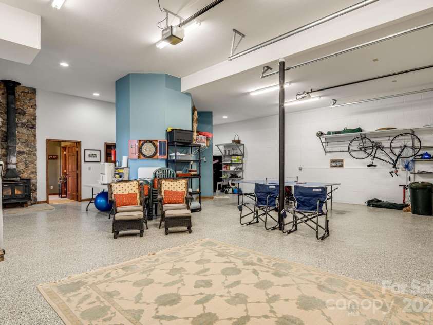 191 Ivy Way, Mars Hill, NC 28754.  MLS# CAR4308782, YatesRealty ID 3424. 1128 sq feet of garage space with oversized doors for larger vehicles. 