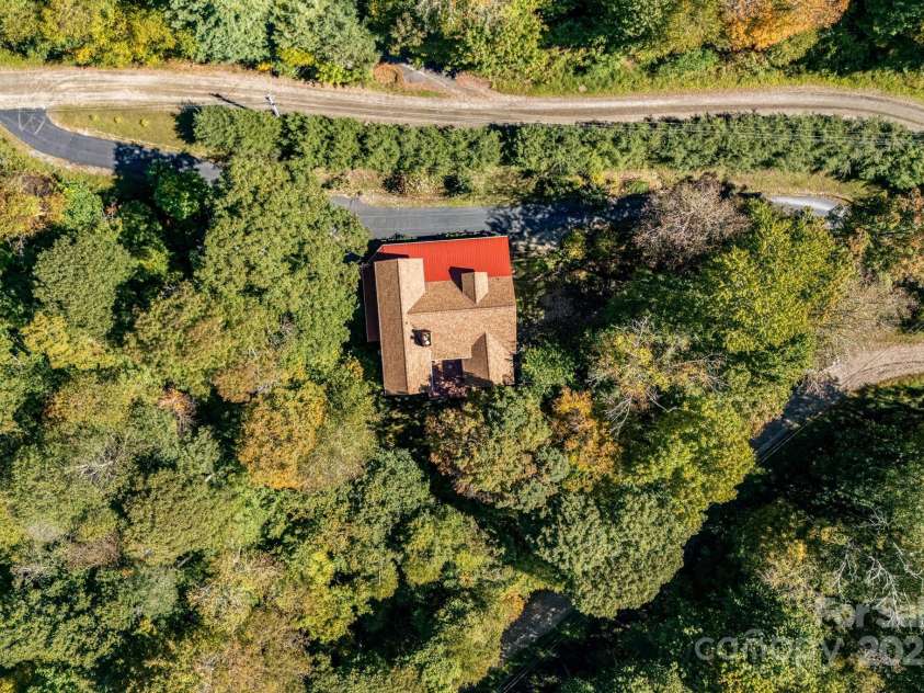 191 Ivy Way, Mars Hill, NC 28754.  MLS# CAR4308782, YatesRealty ID 3424. Lower driveway leads to the garage and basement entrance. Upper paved pull through driveway for easy entry & exits.