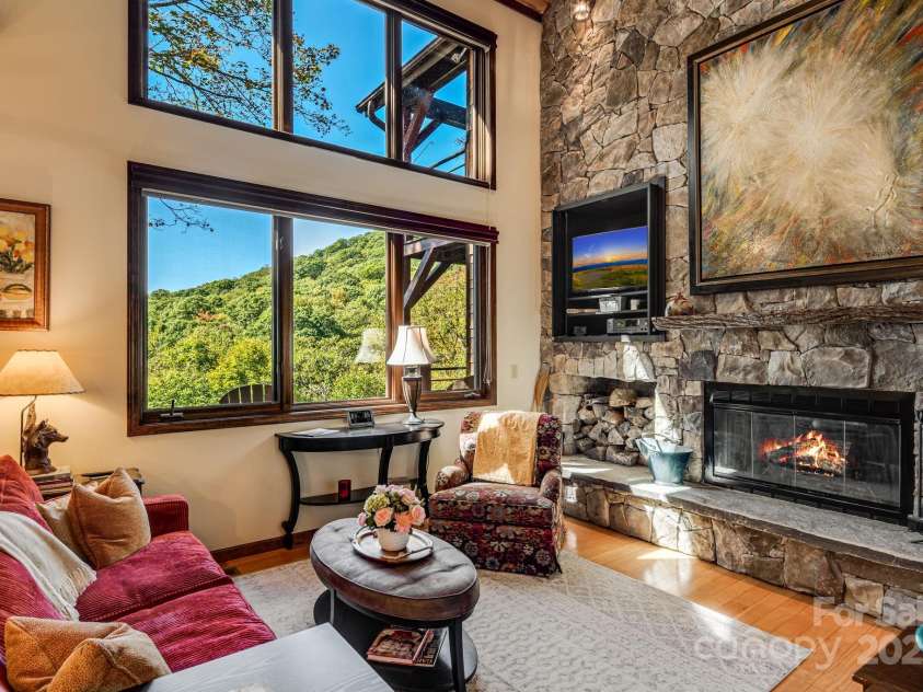 191 Ivy Way, Mars Hill, NC 28754.  MLS# CAR4308782, YatesRealty ID 3424. Vaulted living room with double windows allows views of the mountains from the inside.