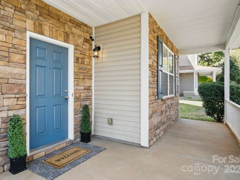 7635 Carrington Forest Lane, Matthews, NC 28105.  MLS# CAR4239500, YatesRealty ID 3424. Large Front Porch, Perfect for Rocking Chairs and Rainy Days