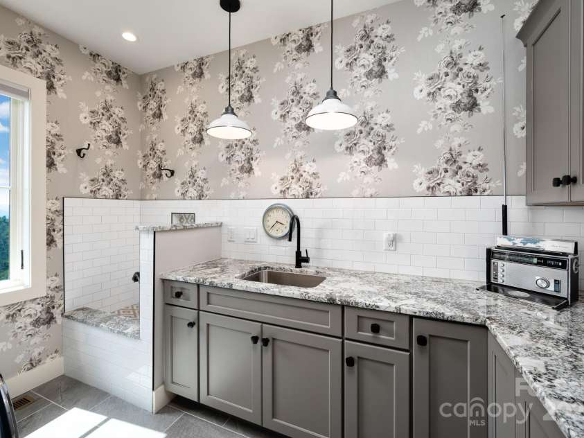 17 Elk Trail, Asheville, NC 28804.  MLS# CAR4291429, YatesRealty ID 34242. Main Level Laundry Room with Dog Washing Station