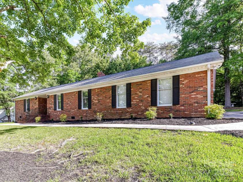 70 Cumberland Court, Concord, NC 28025.  MLS# CAR4253849, YatesRealty ID 34243. From the moment you pull up, you'll notice the quiet surroundings - mature trees offer shade and privacy while the absence of an HOA gives you the freedom to truly make this space your own.
