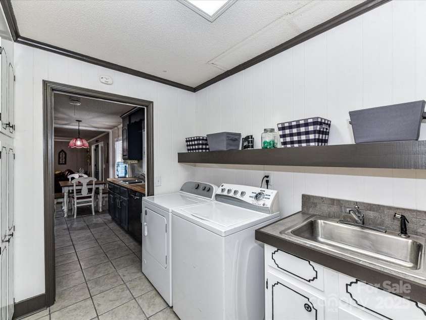 70 Cumberland Court, Concord, NC 28025.  MLS# CAR4253849, YatesRealty ID 34243. Spacious laundry with storage and utility sink