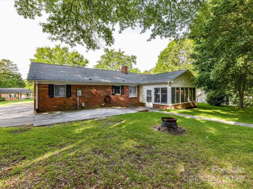 70 Cumberland Court, Concord, NC 28025.  MLS# CAR4253849, YatesRealty ID 34243. Step outside and enjoy your own private backyard retreat. A beautiful, flat greent law surrounding the home - perfect for gardening, play or simply relaxing under the Carolina Sky.  The oversized patio is ideal for outdo