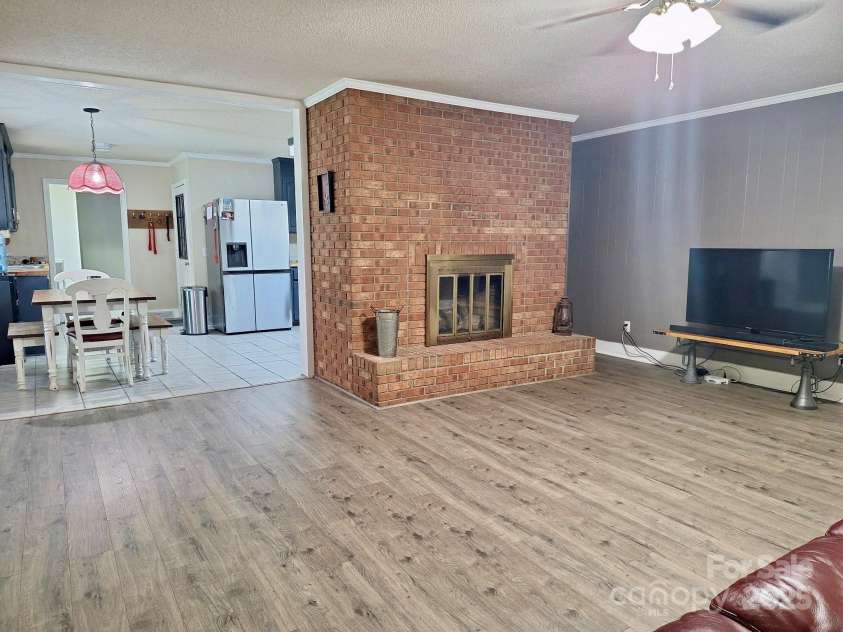 70 Cumberland Court, Concord, NC 28025.  MLS# CAR4253849, YatesRealty ID 34243. Wow this brick fireplace is EVERYTHING.  Imagine the possiblities.  Hard to find a beautiful floor to ceiling brick fireplace.  Iconic feature.