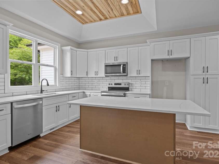 5037 Faith Road, Salisbury, NC 28146.  MLS# CAR4204735, YatesRealty ID 34251. Kitchen-Quartz counter Tops- Island