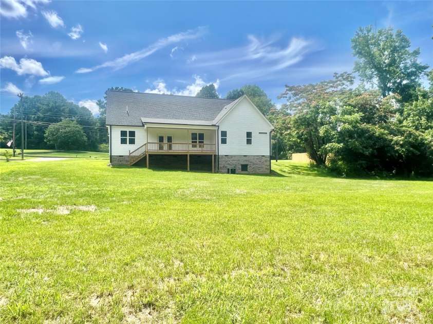 5037 Faith Road, Salisbury, NC 28146.  MLS# CAR4204735, YatesRealty ID 34251. Wonderful covered deck HUGE flat back yard!