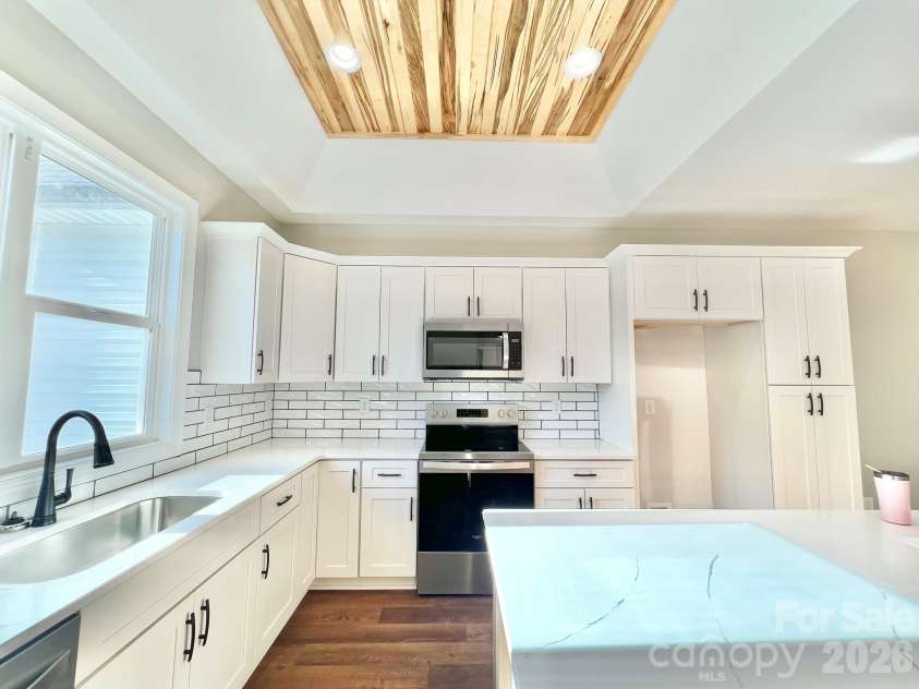 5037 Faith Road, Salisbury, NC 28146.  MLS# CAR4332559, YatesRealty ID 34251. Beautiful kitchen with custom trey ceiling