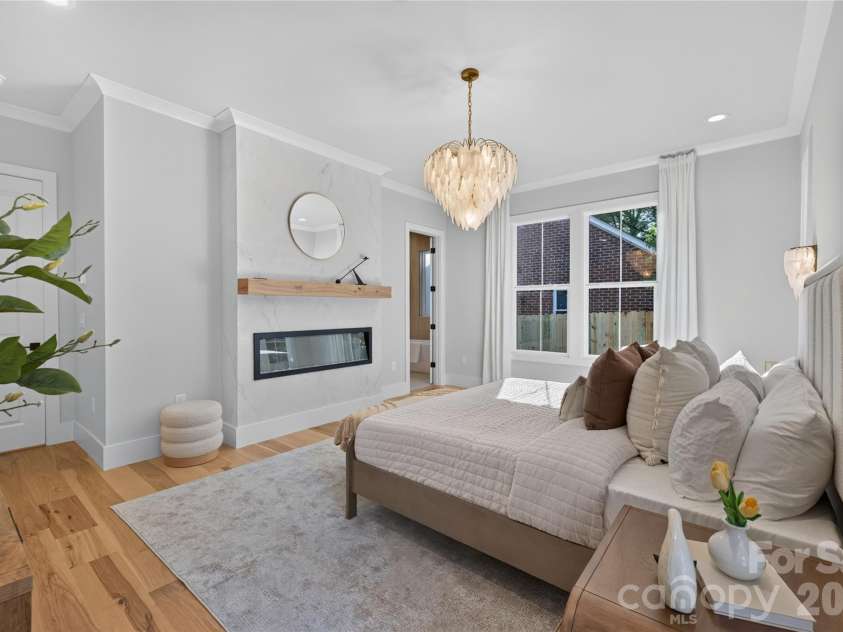 3119 Shenandoah Avenue, Charlotte, NC 28205.  MLS# CAR4394625, YatesRealty ID 34254. Primary suite boasts fashion-forward Venetian Plaster surround gas fireplace!